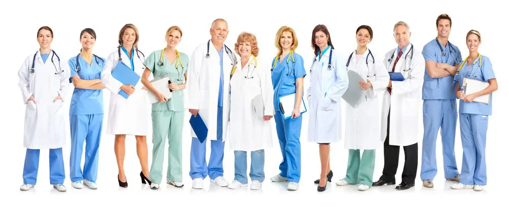 A group of doctors and nurses standing together.